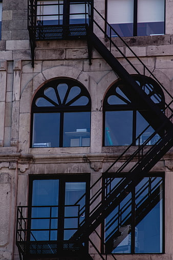 Black Fire Escape Stairs on Urban Building Facade