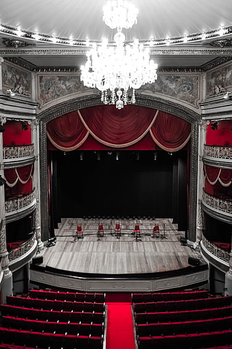 Grand Theater Interior With Red Curtains And Chandelier