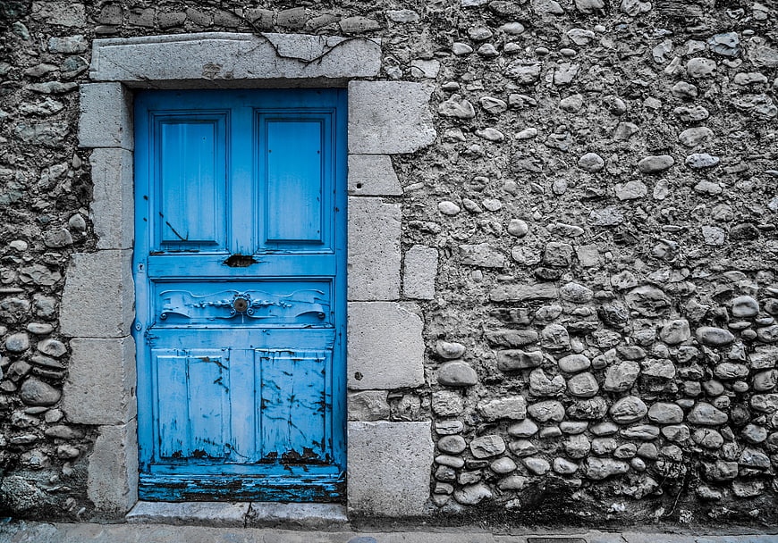 Vintage Blue Wooden Door in Old Stone Wall