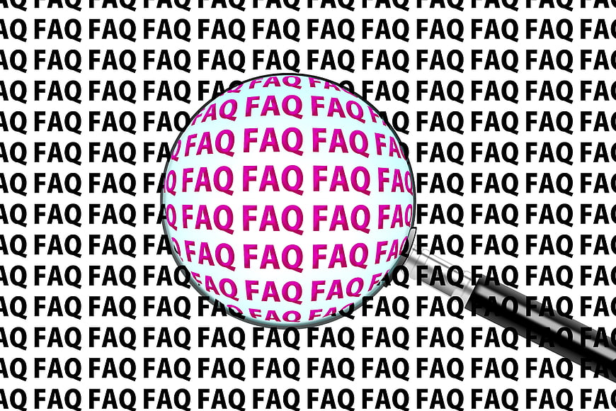 Magnifying glass over repeating FAQ text pattern
