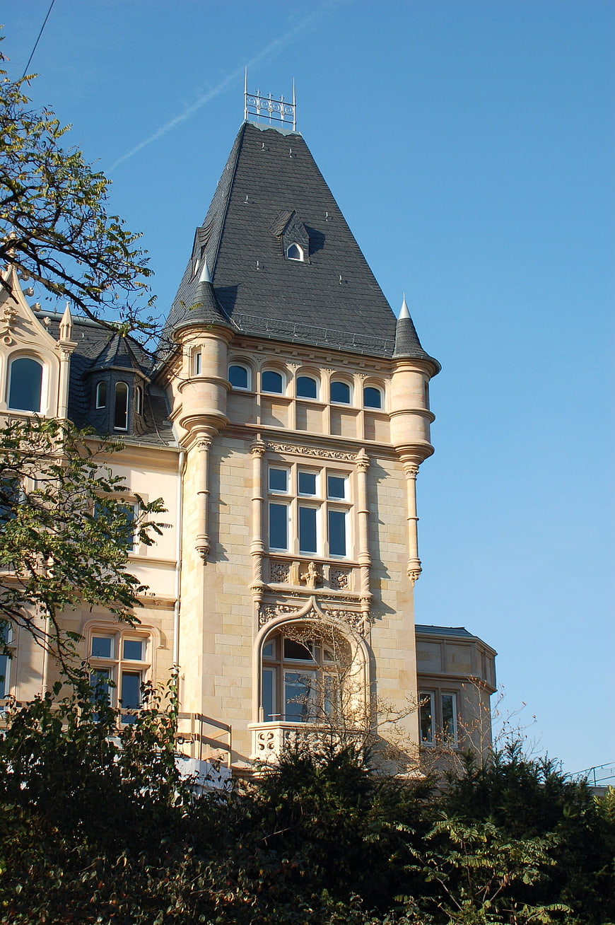Historic Sandstone Castle Tower with Dark Roof