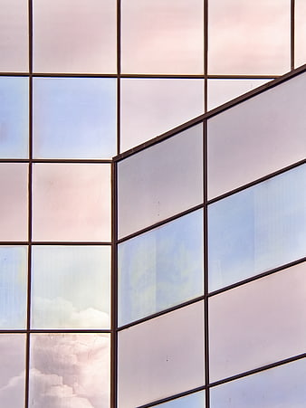 Modern Glass Building Facade with Sky Reflections