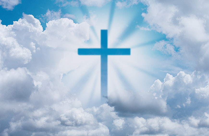 Blue Christian Cross With Divine Light Rays In Cloudy Sky