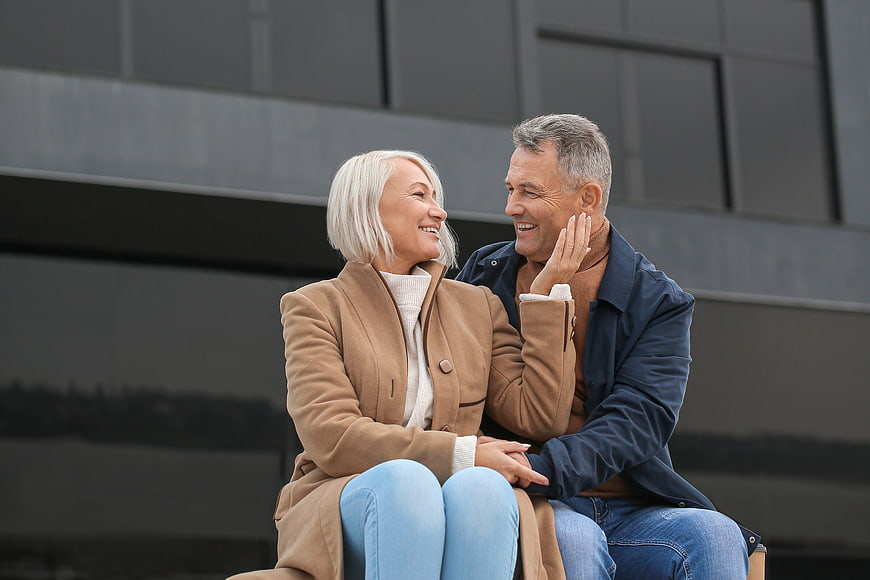 Happy Senior Couple Laughing Together Outdoors