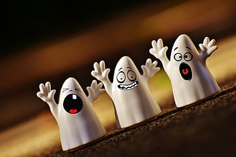 Cute White Ghost Figurines with Spooky Expressions