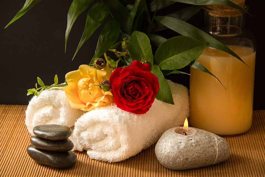 Spa Wellness Still Life With Roses, Candle, Stones, And Bamboo