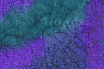 Abstract purple and teal tie-dye silk fabric texture