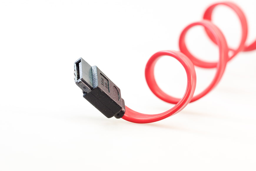 Red SATA Cable Close-Up on White Background