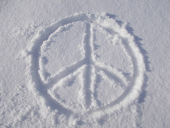 Peace symbol drawn in fresh white snow
