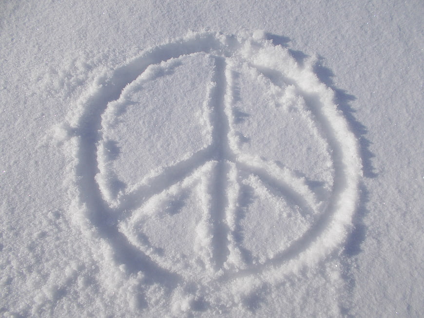 Peace symbol drawn in fresh white snow