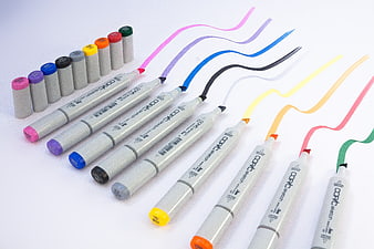 Colorful Copic Sketch Markers With Vibrant Swatches On White Background