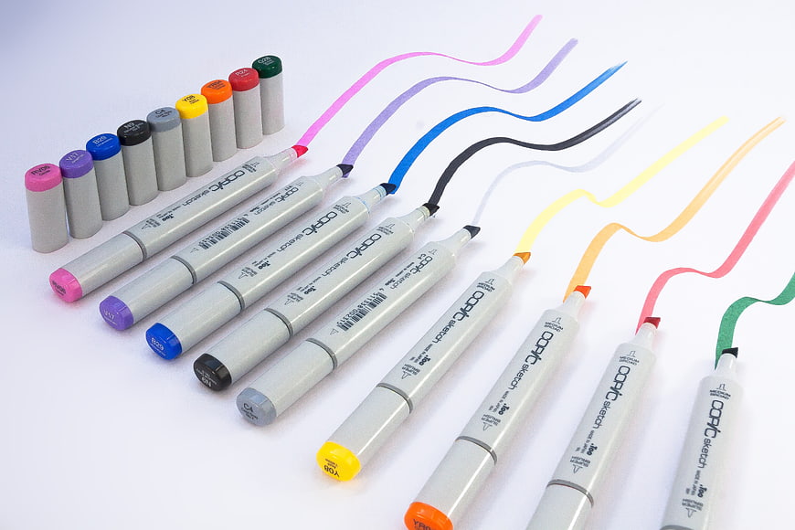 Colorful Copic Sketch Markers With Vibrant Swatches On White Background