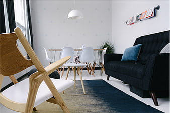 Modern Scandinavian Living Room with Wooden Chair and Black Sofa