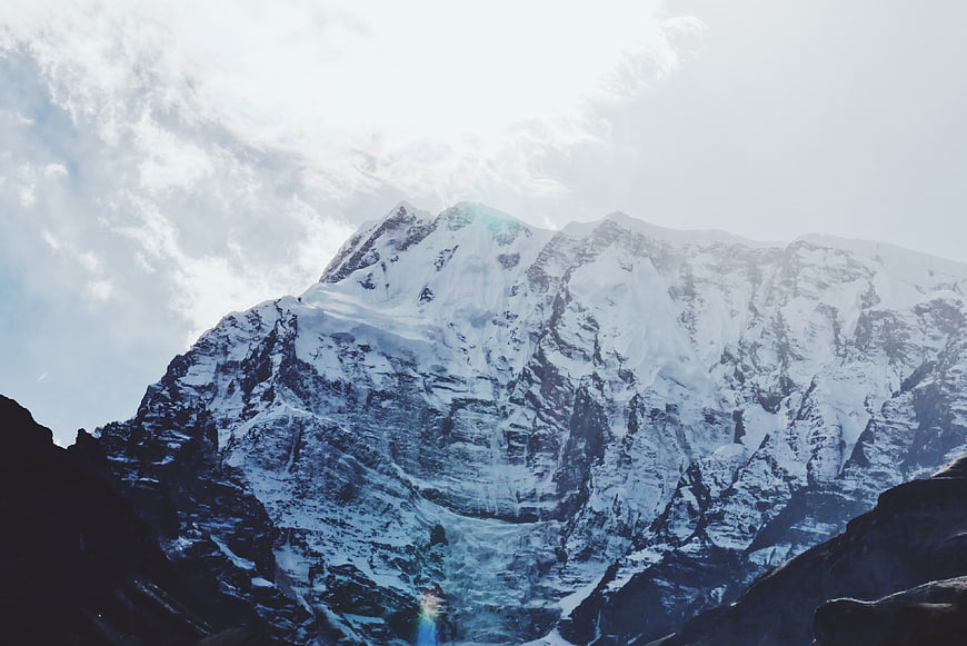 Majestic Snow-Capped Mountain Peak with Clouds