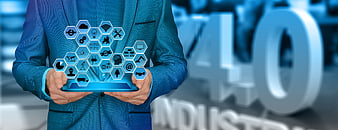 Businessman holding tablet with Industry 4.0 technology icons