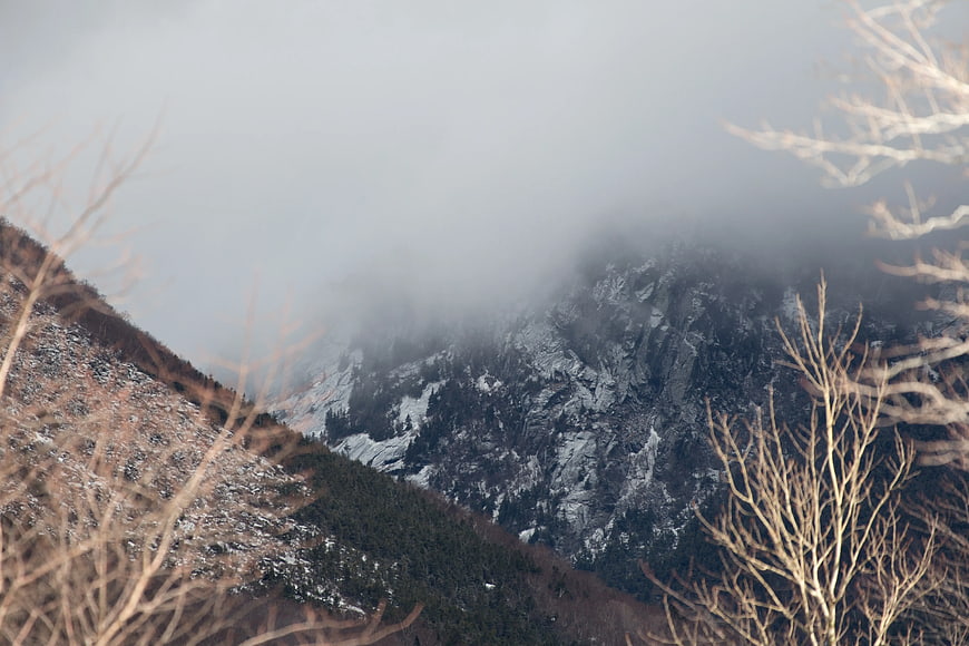 Misty Mountain Landscape with Bare Winter Branches