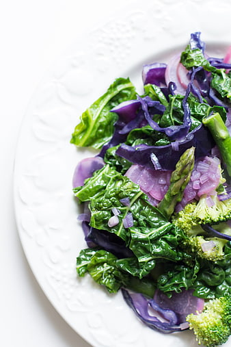 Healthy sauteed kale, asparagus, and red cabbage salad