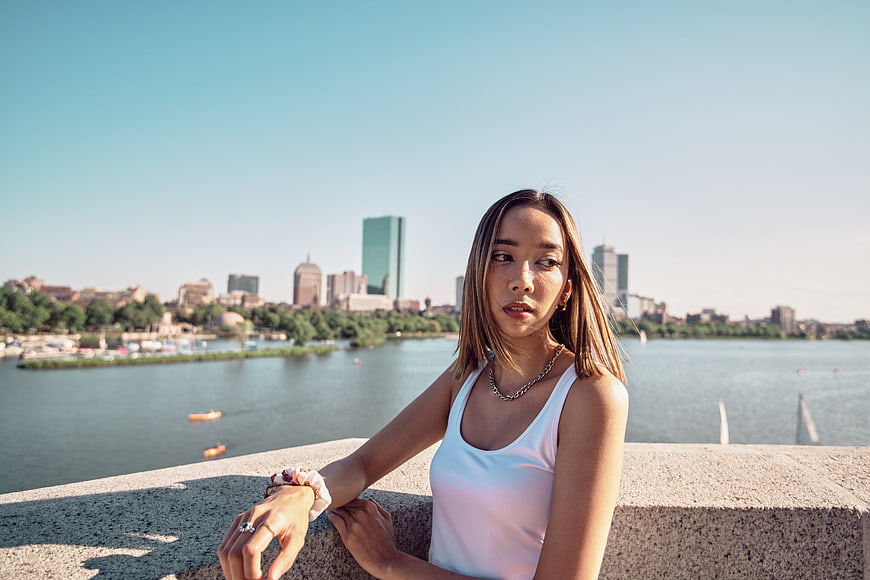 Young Asian Woman Portrait with City Skyline Background