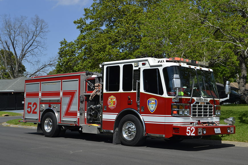 Red and White Fire Engine 52 Parked on Suburban Street