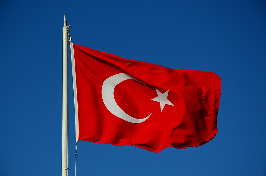Turkish National Flag Waving Against Clear Blue Sky