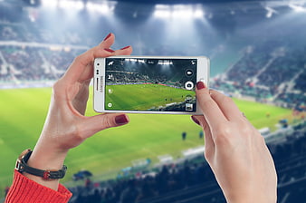 Woman Taking Photo of Soccer Match on White Samsung Smartphone