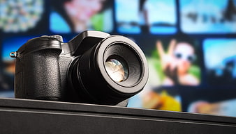 Black DSLR Camera with Blurred Photo Grid Background