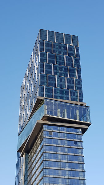 Modern Glass Skyscraper with Cantilevered Section