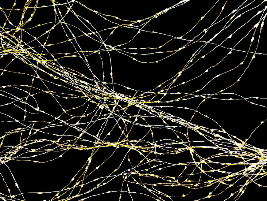 Abstract glowing neural network connections on black background