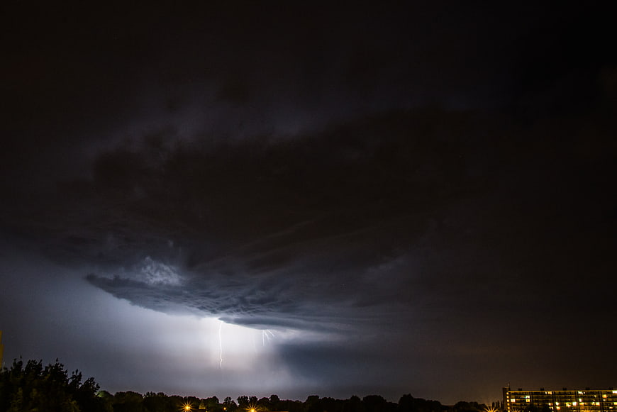 Dramatic Night Lightning Storm Over City Skyline