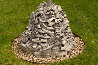 Gray Shoe Sculpture on Grass