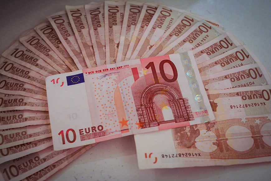 Fan of 10 Euro Banknotes on White Surface