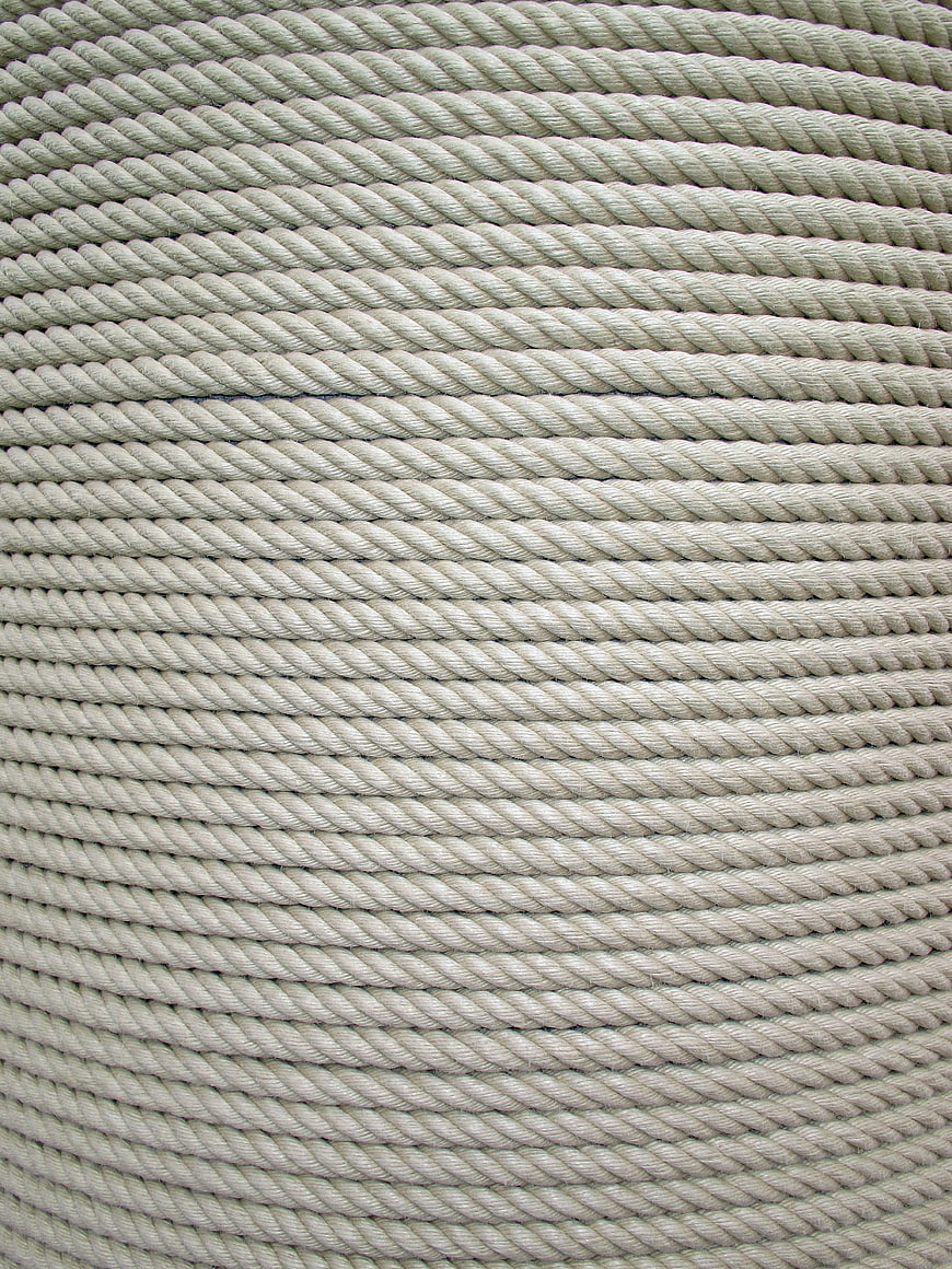 Close-up texture of coiled beige twisted rope