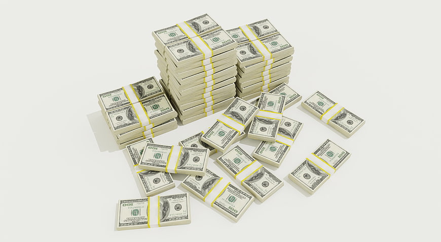 Stacks of US Dollar Bills on White Background