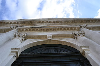 Low angle view of classical stone archway and columns