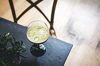 Green Matcha Cocktail in Glass on Dark Table