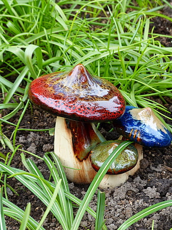 Colorful Ceramic Mushroom Garden Decor in Green Grass