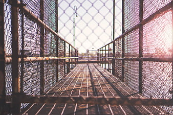 Perspective View of Metal Grating Bridge with Chain Link Fence