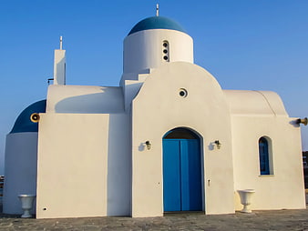 Traditional Greek Orthodox Church with Blue Dome and White Walls