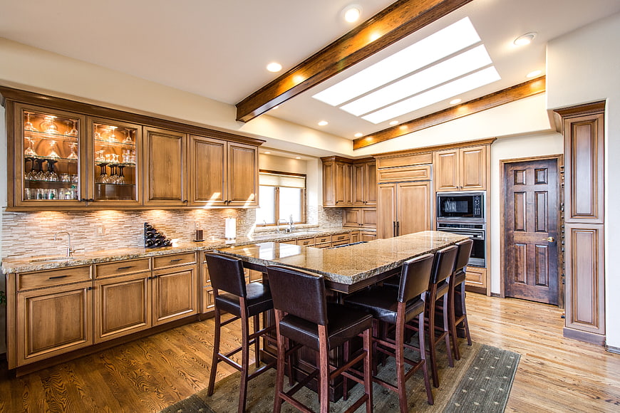 Luxury Kitchen Interior With Wooden Cabinets And Granite Island