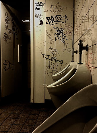 Gritty Public Men's Restroom with Graffiti and Urinals