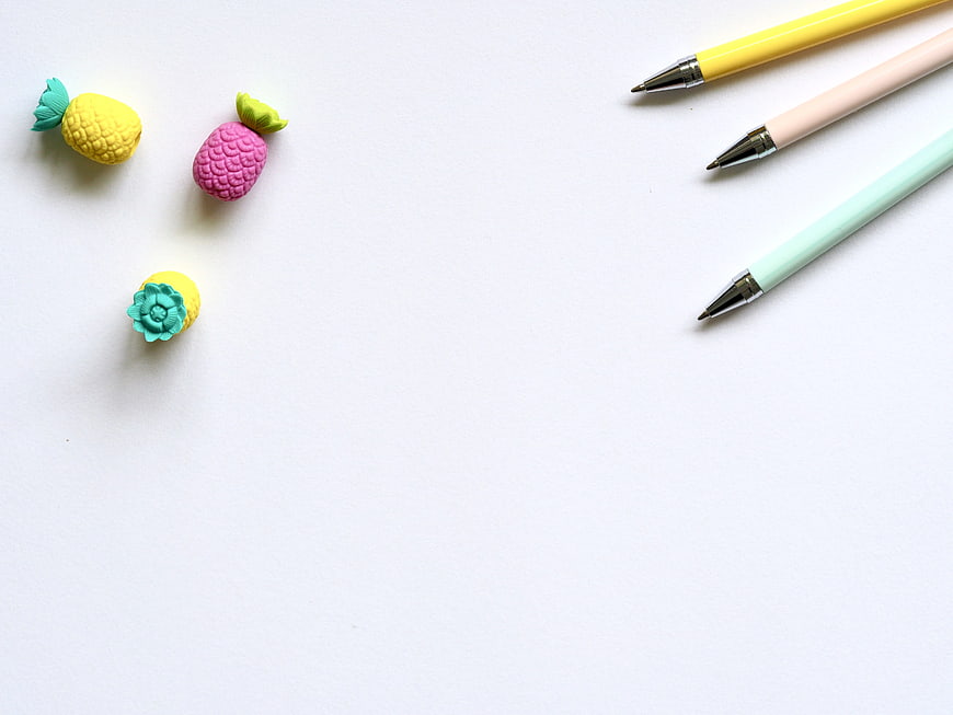 Pastel Pineapple Erasers and Pens on White Background