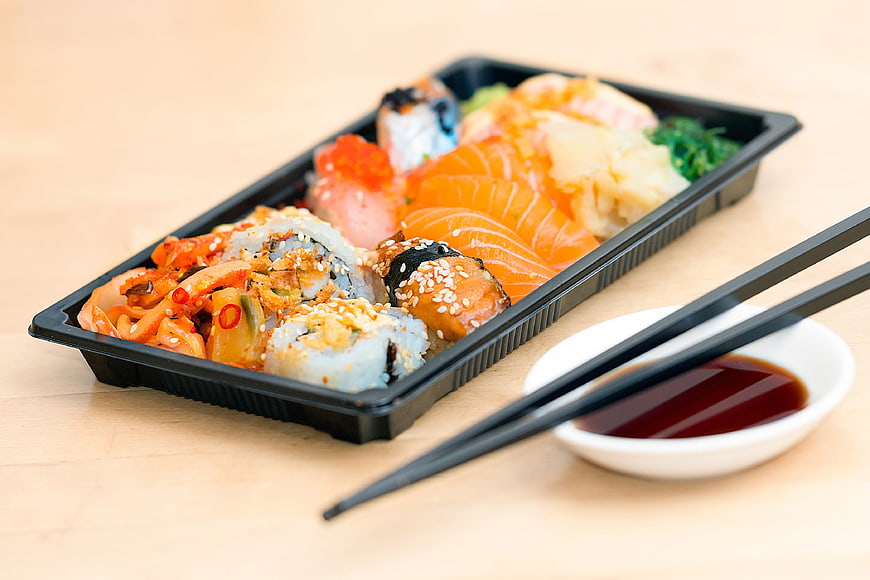 Assorted Sushi Bento Box with Soy Sauce and Chopsticks