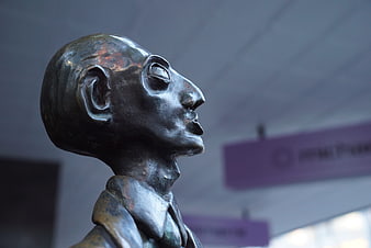 Close-up of bronze businessman sculpture head in profile