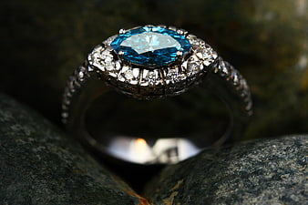 Close-up of Blue Sapphire Ring with Diamonds on Rock