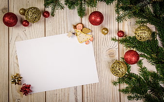 Christmas flat lay with ornaments, pine branches, and blank card