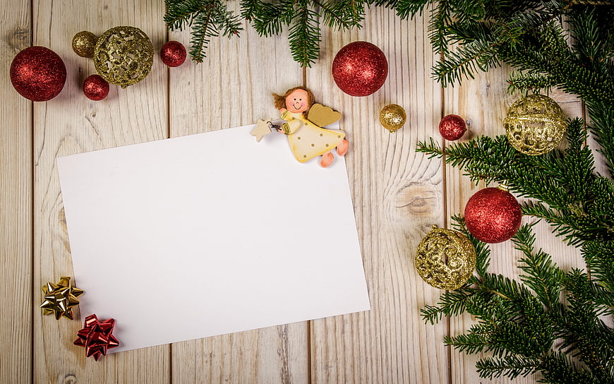 Christmas flat lay with ornaments, pine branches, and blank card