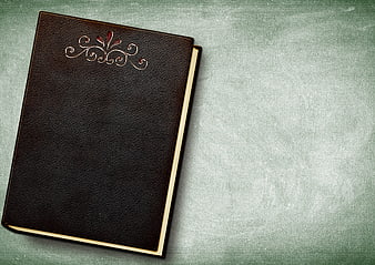 Vintage Brown Leather Book With Embossed Floral Design On Textured Background