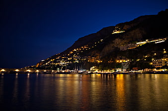 Amalfi Coast Night View with Boats and Cliff Lights