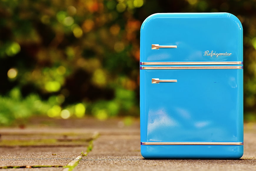 Blue Vintage Miniature Refrigerator on Outdoor Surface