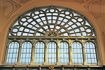 Ornate Gothic Arched Window with Intricate Ironwork